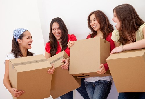 Packed moving boxes and furniture ready for transport