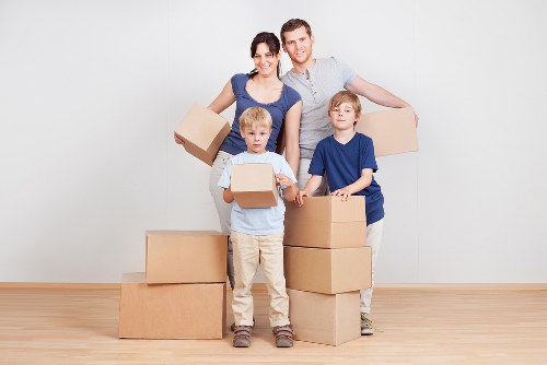 Packed moving boxes and furniture ready for local removal service
