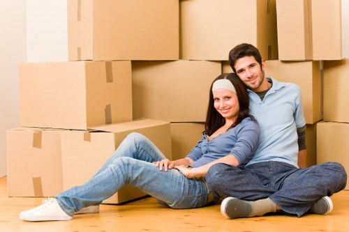 Commercial and domestic items prepared for transport by a man with a van