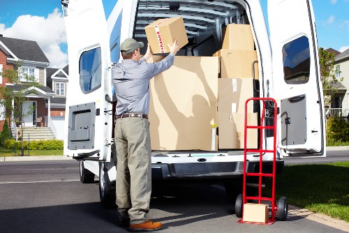 Packed boxes and furniture prepared for removal truck hire