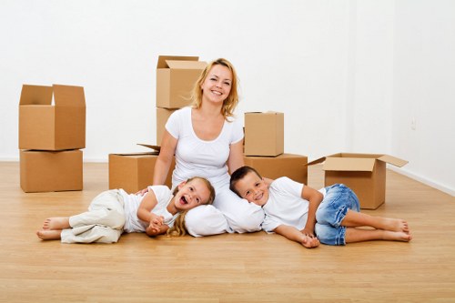 Movers navigating stairs and access challenges in a Hillingdon property